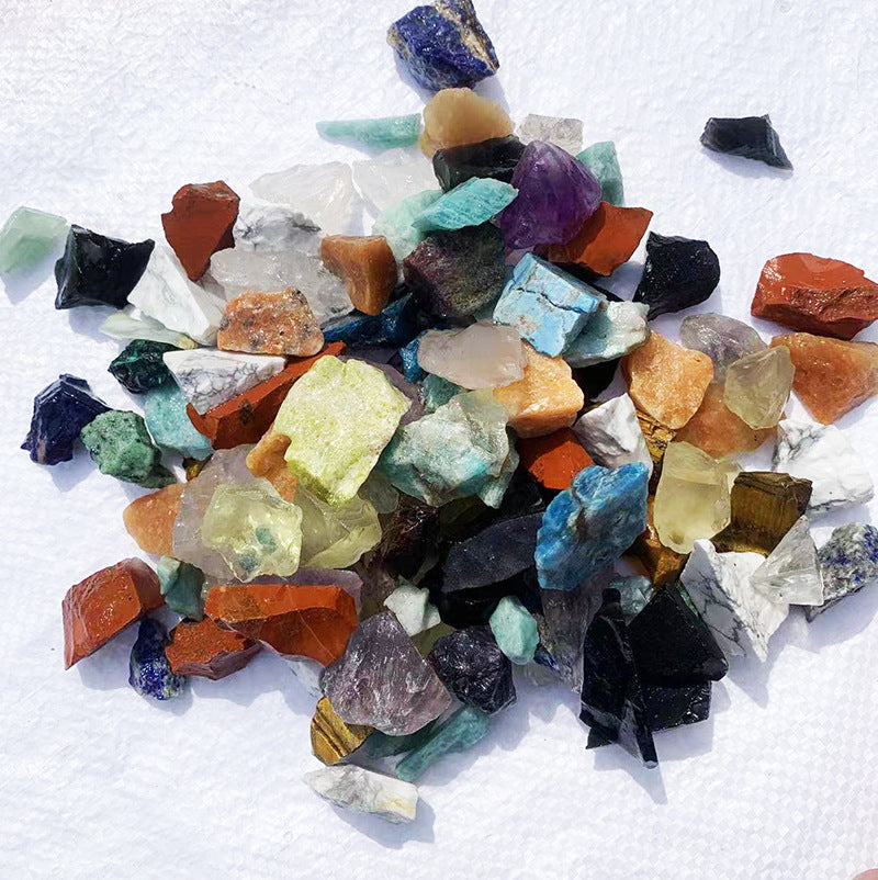 Assorted colorful crystals on a white textured background