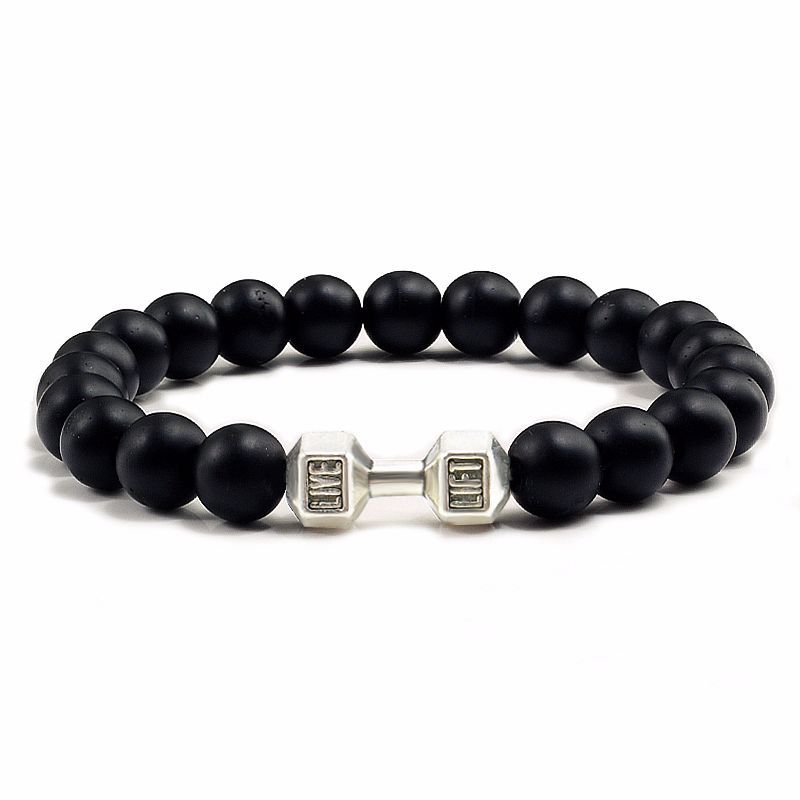 Black beaded bracelet with silver bar clasp on a white background