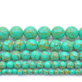 Turquoise beads with gold speckles on a white background
