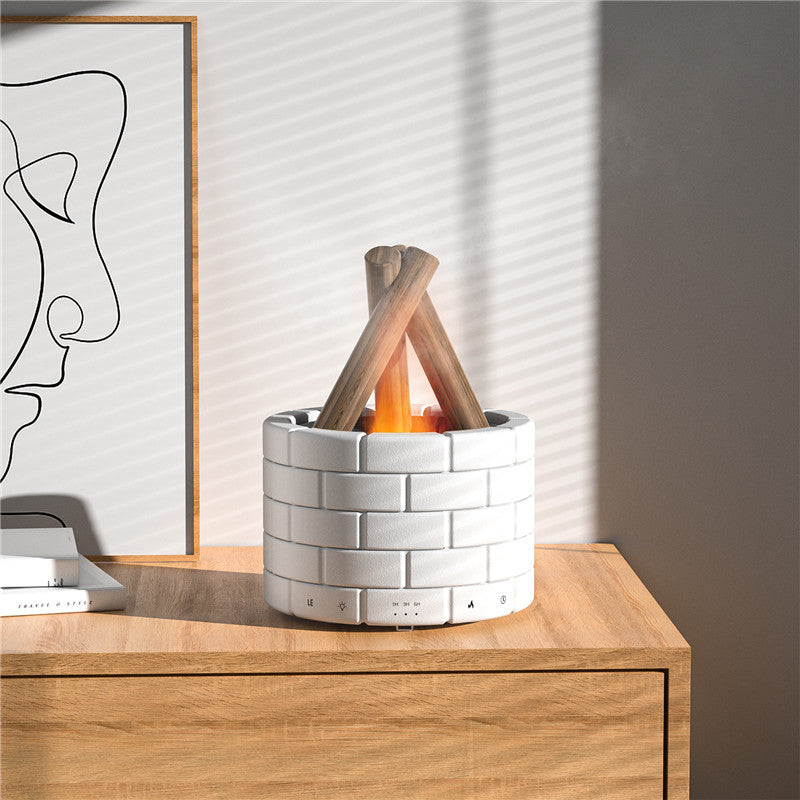 Modern indoor fire pit on a wooden surface with abstract art in the background