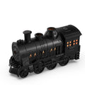 Black toy train engine on a white background
