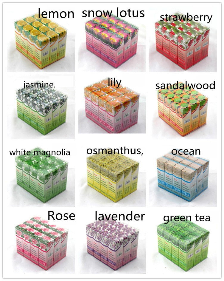 Assorted boxes labeled with different scents on a white background