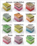 Assorted boxes labeled with different scents on a white background