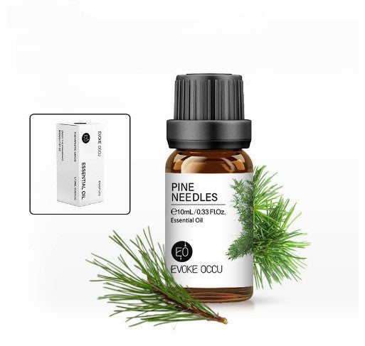 Pine needles essential oil bottle with packaging on a white background