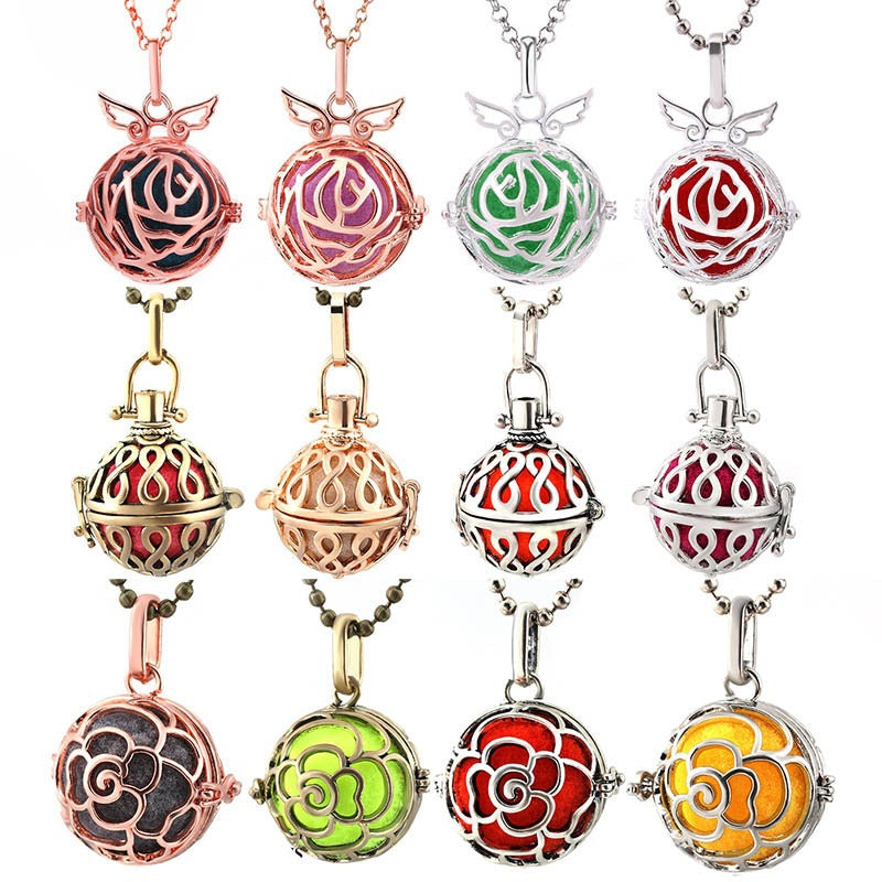Set of colorful pendant necklaces with intricate designs on a white background