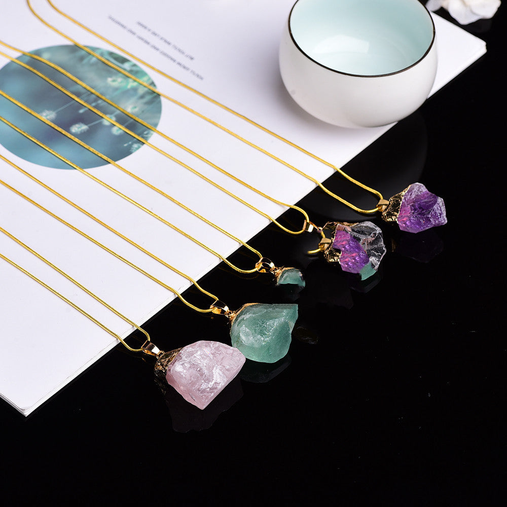Gold hairpins with colorful gemstones on a magazine