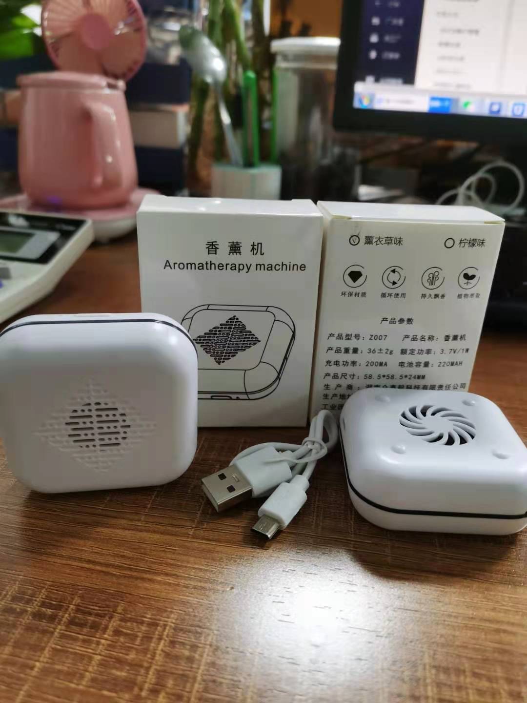 Aromatherapy machine with packaging on a wooden surface