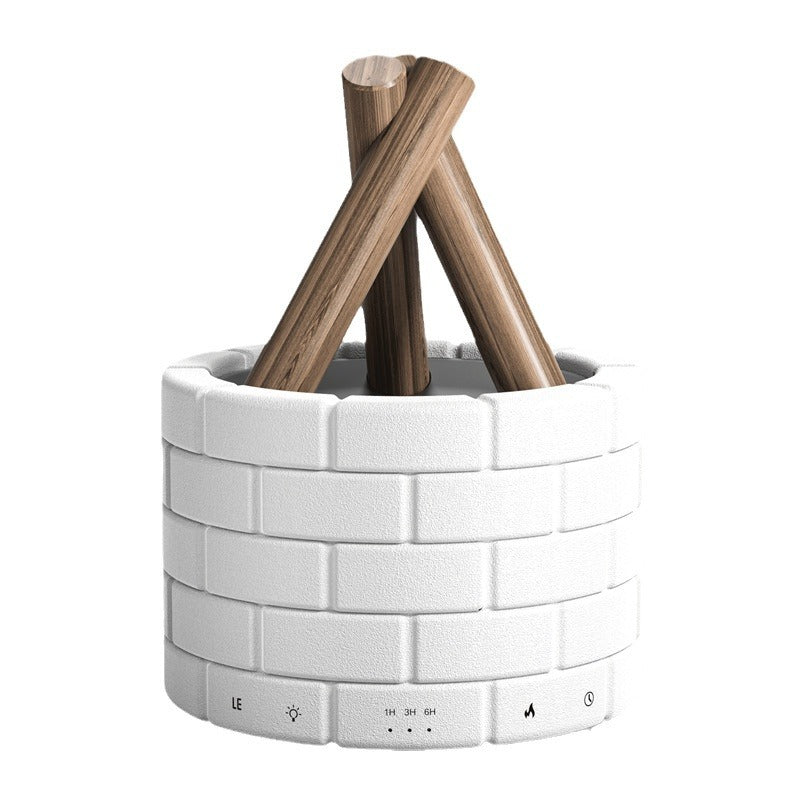 White cylindrical container with wooden sticks on a white background
