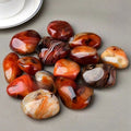 Collection of marbled stones on a gray surface