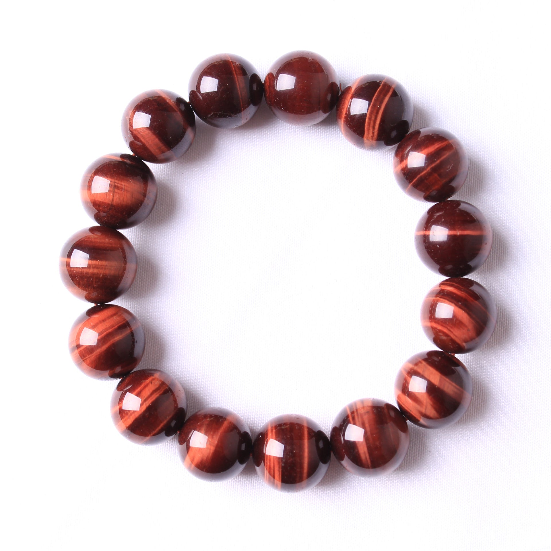 Red tiger eye beaded bracelet on a white background
