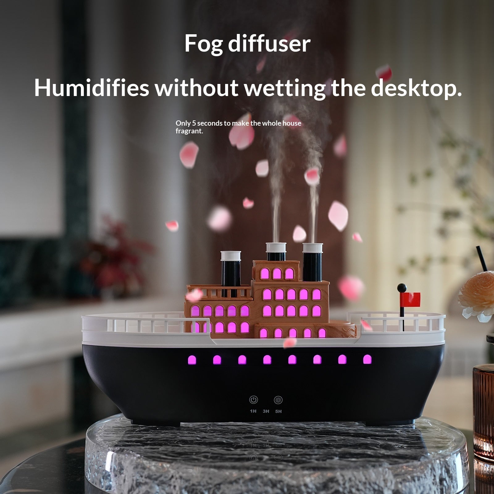 Fog diffuser with building model on a desk, emitting mist.