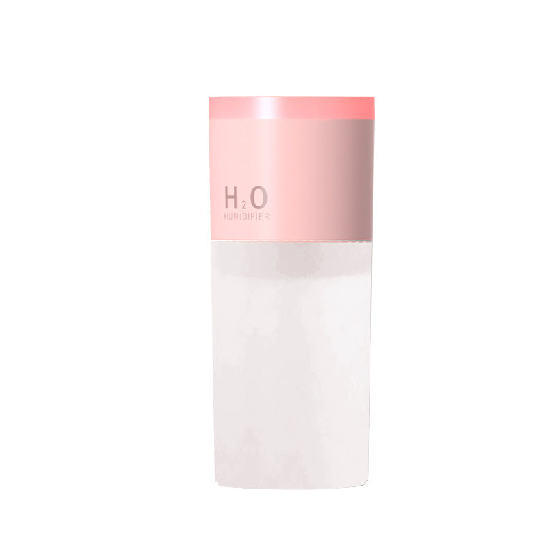 Skincare product with pink cap and white body on a white background
