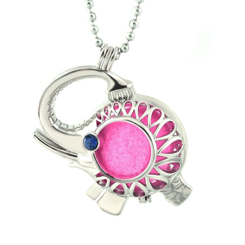 Necklace with a pink pendant and blue gemstone on a white background