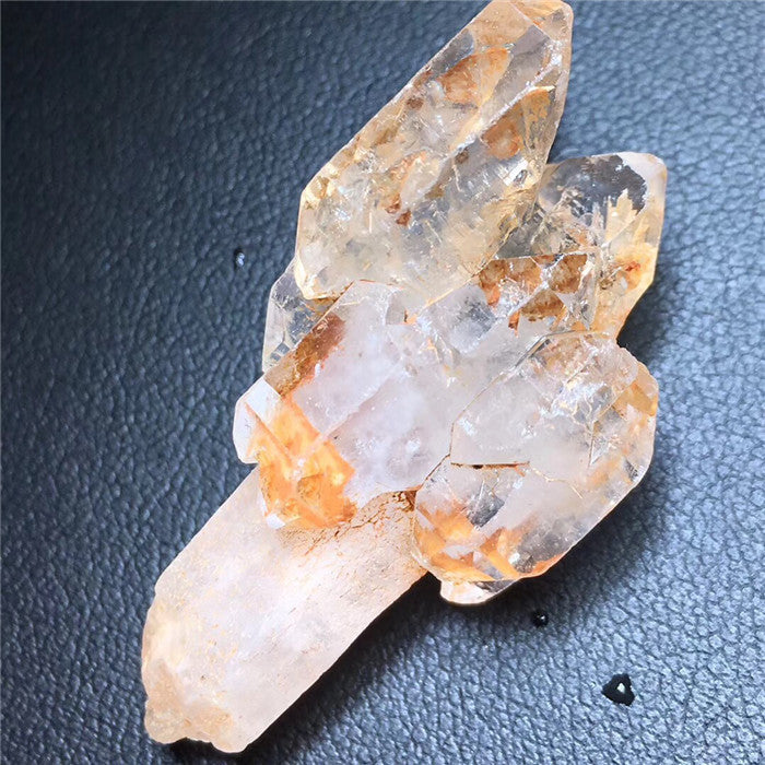 Crystal cluster on a dark textured surface