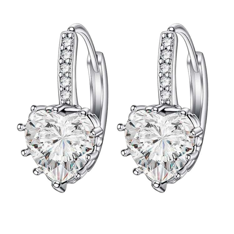 Heart-shaped diamond earrings on a white background