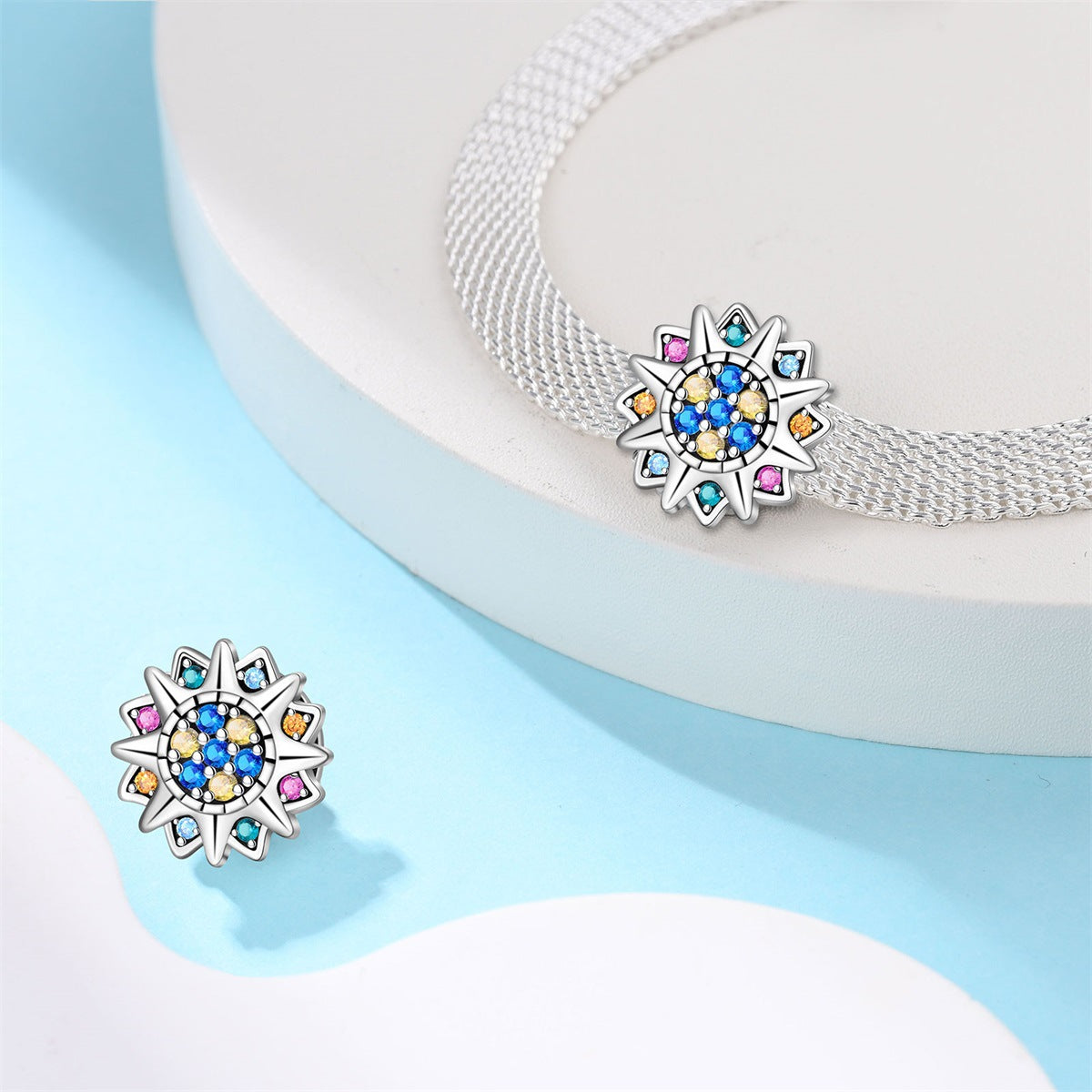Colorful star-shaped earrings on a light blue background