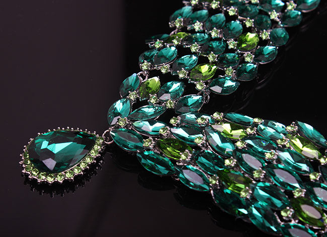 Green gemstone necklace on a dark background