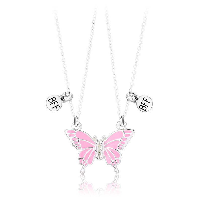 Butterfly necklace with 'BFF' charms on a white background