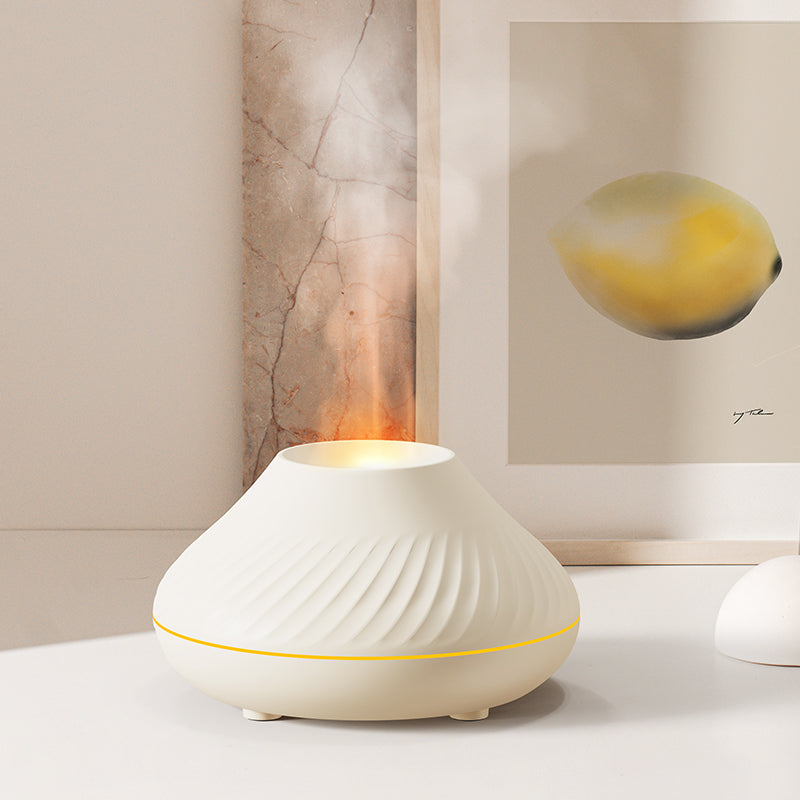 White diffuser on a table with abstract art in the background