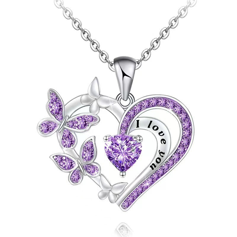 Silver necklace with purple heart and butterfly pendant on a white background