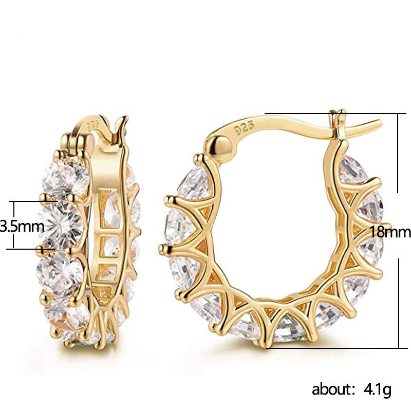 Gold hoop earrings with clear stones and measurements on a white background