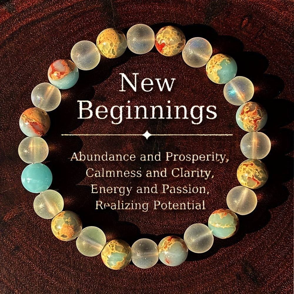 Necklace with marbled beads on a dark background with motivational text.