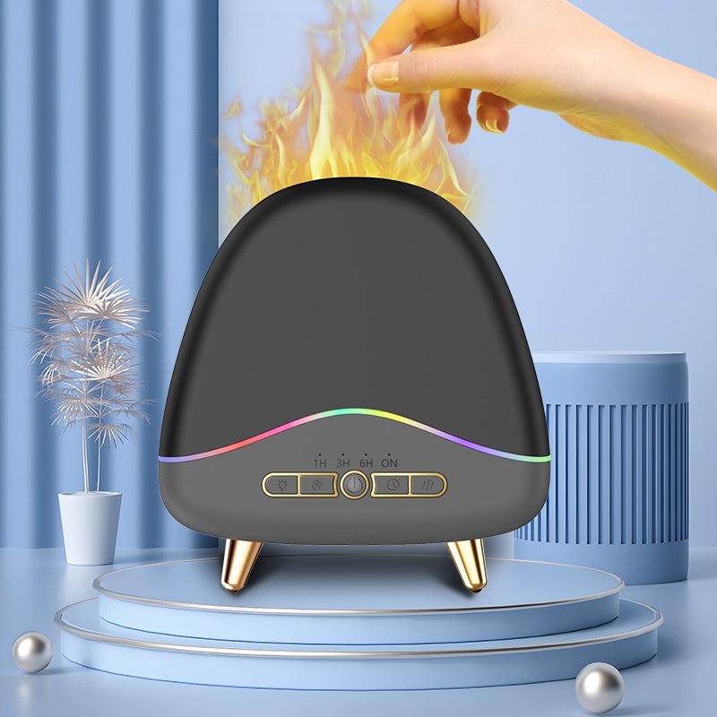 Black humidifier with rainbow lights on a blue platform, hand holding a flame above it.